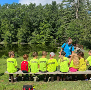Angelina Rodriguez ‘27 with campers at the Wilton Wildlife preserve