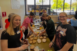 Students preparing sandwiches to feed our neighbors in the community