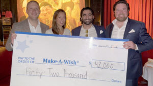 Ryan Chismark with check for the Make a Wish foundation